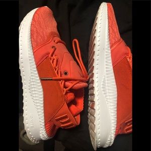 Puma orange tennis shoes